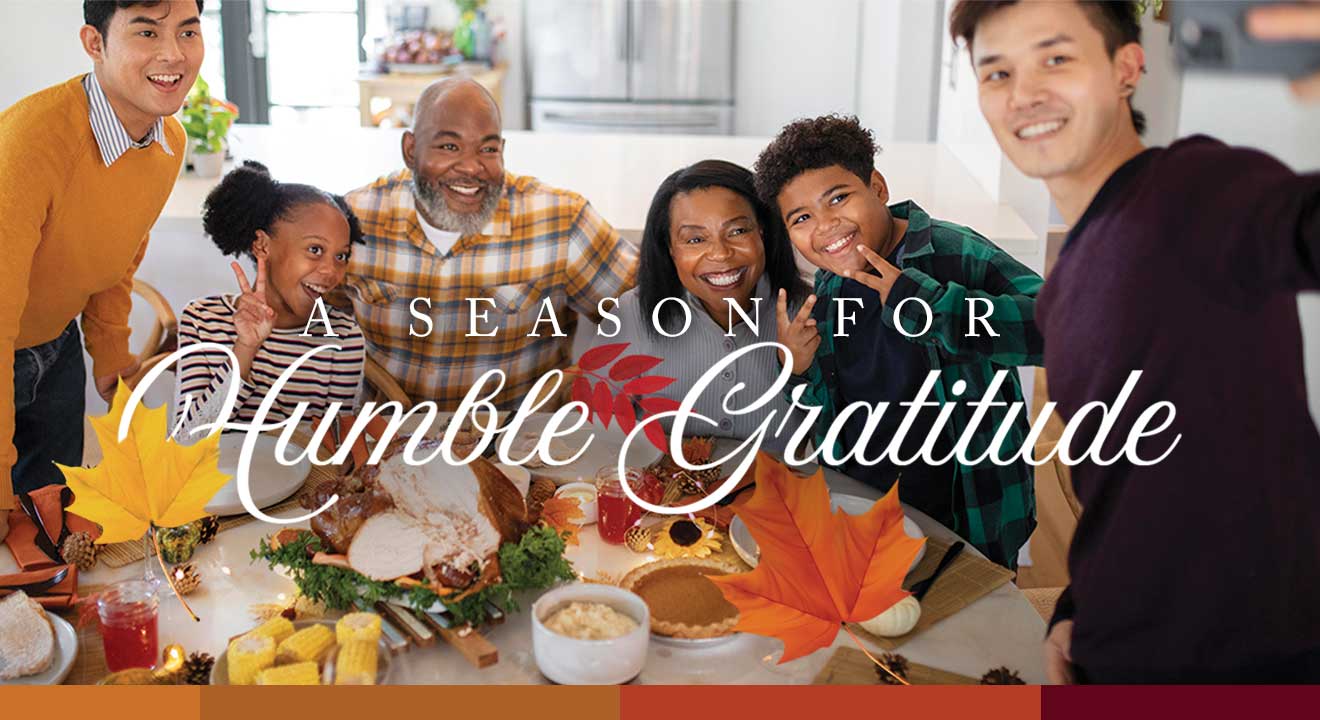 A Season for Humble Gratitude article.  Image of family around Thanksgiving meal